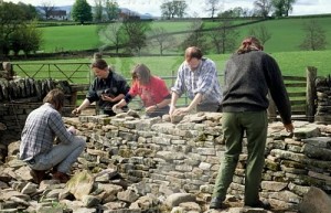 photo of people building a dry stone wall